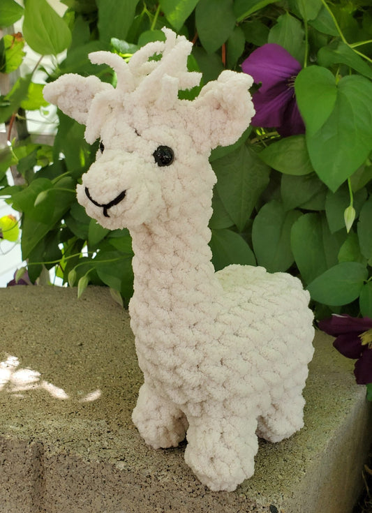 A crocheted tan alpaca made with Bernat Blanket Yarn