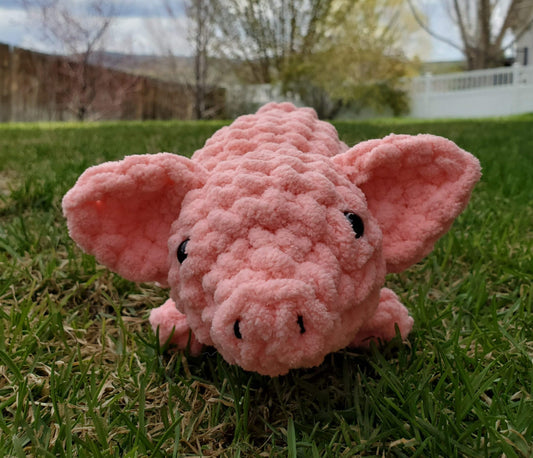 Crocheted amigurumi pig in pink bernat blanket yarn