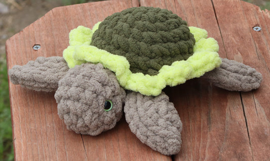 Crocheted sea turtle plushie using olive, lemon-lime, and baby sand Bernat Blanket yarn
